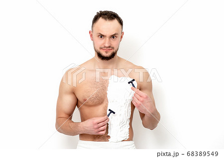Young man shaving his chest 68389549