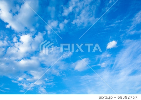 Cirrus and cumulus clouds on blue sky background. 68392757
