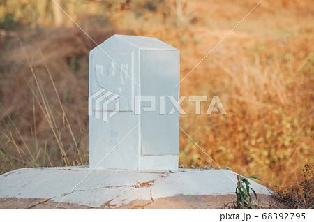 Milestone or Kilometer marker in Thailand..White milestone with grass roadside to Chiang Rai..Milestone on road concept. .Distance marker showing the distance in kilometers to Chiang Rai Milestone or Kilometer marker in Thailand..White milestone with grass roadside to Chiang Rai..Milestone on road concept. .Distance marker showing the distance in kilometers to Chiang Rai 68392795