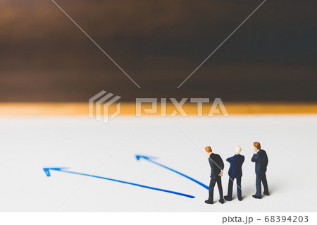 Miniature Businessman standing on arrow pathway , Miniature Businessman standing on arrow pathway , 68394203