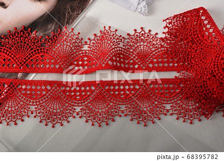 Tapes of red gentle guipure, beauty lace fabric. 68395782