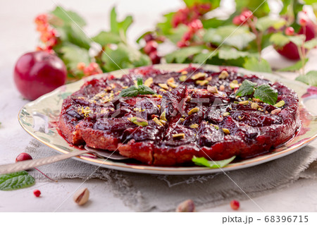 Traditional upside-down pie with plums. 68396715
