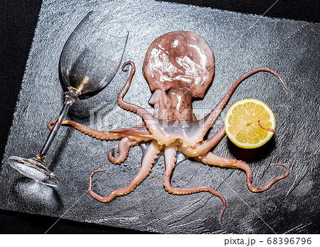 Octopus holds wine with lemon Octopus holds wine with lemon 68396796