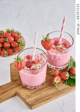 Strawberry milk shake in glass with straw and Strawberry milk shake in glass with straw and 68397233