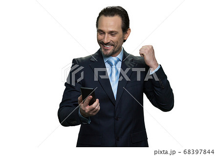 Joyful middle-aged man is cheerful and successful. Joyful middle-aged man is cheerful and successful. 68397844