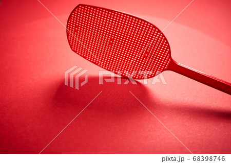 red isolated plastic fly trap on intense colored background 68398746