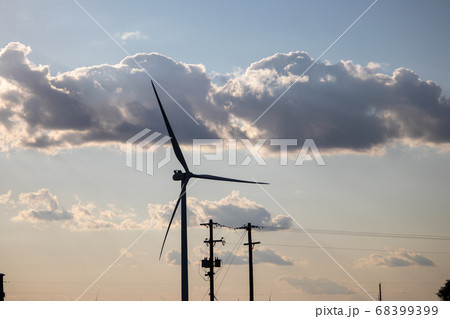 Clouds in the sky on a cloudy day full of Wind Turbines  68399399