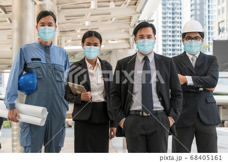 Confident business people with face mask protect from Coronavirus or COVID-19. 68405161