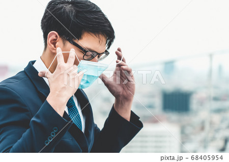Young office worker with face mask quarantine from coronavirus or COVID-19. Young office worker with face mask quarantine from coronavirus or COVID-19. 68405954