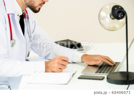 Doctor working on laptop computer hospital. Doctor working on laptop computer hospital. 68406071