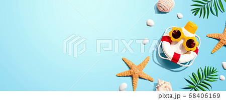 Sunblock bottle wearing sunglasses with starfish and seashells Sunblock bottle wearing sunglasses with starfish and seashells 68406169