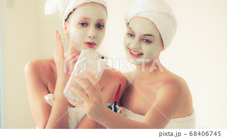 Beautiful woman having a facial treatment at spa. Beautiful woman having a facial treatment at spa. 68406745