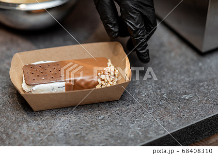 Chef with chocolate ice cream, close-up Chef with chocolate ice cream, close-up 68408310