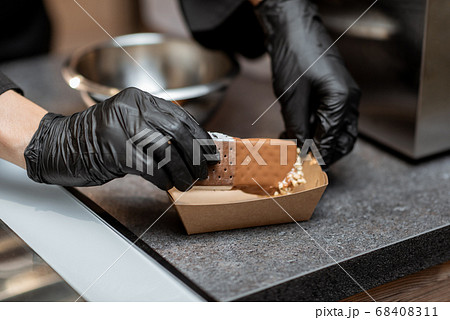 Making chocolate ice cream with topping Making chocolate ice cream with topping 68408311