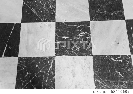 Black and white checkered marble floor 68410607