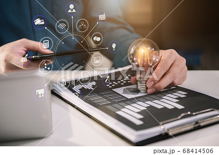 Business man using digital tablet analyzes business data, busy working on laptop computer with smart phone and business report on office desk. Business man using digital tablet analyzes business data, busy working on laptop computer with smart phone and business report on office desk. 68414506