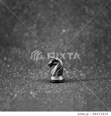 black chess knight horse on the black bokeh 68415834