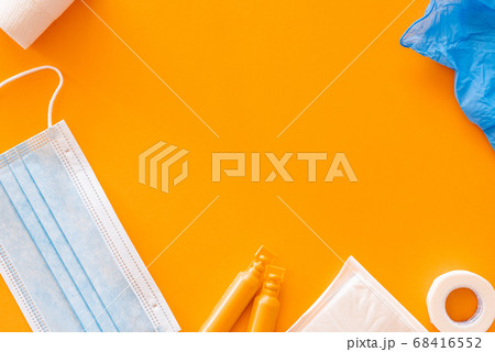 Flat lay of several medical supplies against a Flat lay of several medical supplies against a 68416552