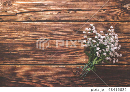 Flat lay of a bouquet of flowers against a rustic Flat lay of a bouquet of flowers against a rustic 68416822