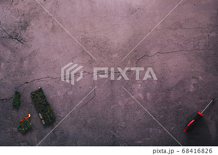 Flat lay of some motherboards and a screwdriver Flat lay of some motherboards and a screwdriver 68416826