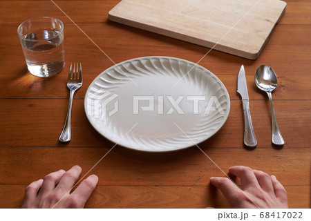 Point of view of a person about to eat on an empty Point of view of a person about to eat on an empty 68417022
