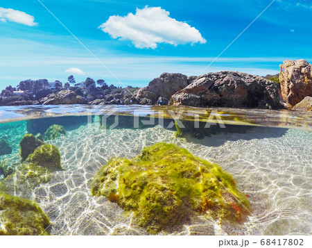 Colorful water in Alghero shore 68417802