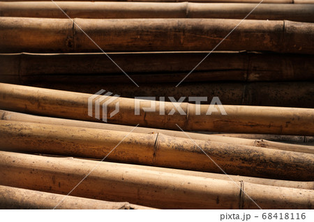 Bamboo poles closeup used for scaffolding on buildings Bamboo poles closeup used for scaffolding on buildings 68418116