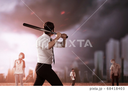 Asian man standing with a baseball bat on his hand ready to attack zombie 68418403