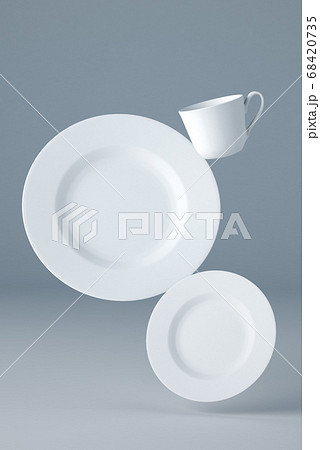 Mockup of two white plates and a cup levitating on blue background 68420735