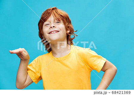 boy with red hair dancing on a blue background African dance boy with red hair dancing on a blue background African dance 68421369