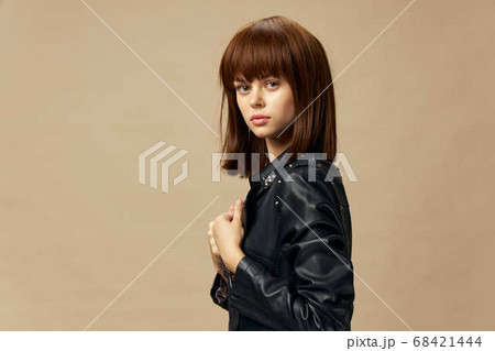 Fashion woman model posing beige background. Beautiful skin and hair caret 68421444