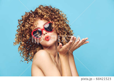 Charming model dancing on an isolated background, fashion sunglasses Charming model dancing on an isolated background, fashion sunglasses 68421523
