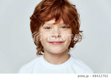 portrait of a redhead boy smile cropped view face closeup freckles portrait of a redhead boy smile cropped view face closeup freckles 68422702