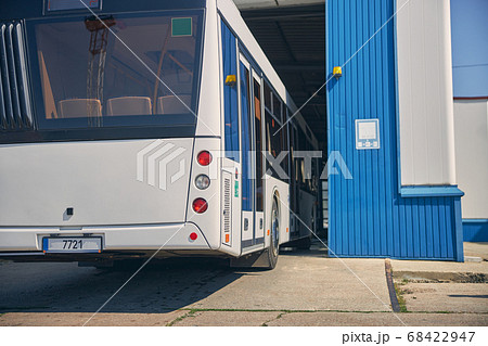 Big bus arriving at the car wash station 68422947