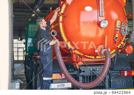 Kind male person standing in semi position near barrel 68422964