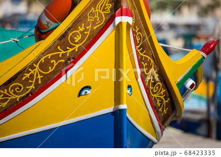 Details of the colourful traditional Maltese fishing boats, the luzzu with eye of Horus or of Osiris. Marsaxlokk port, Malta Details of the colourful traditional Maltese fishing boats, the luzzu with eye of Horus or of Osiris. Marsaxlokk port, Malta 68423335