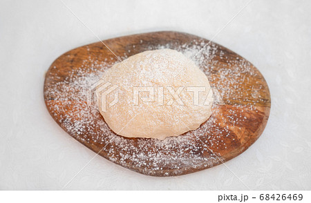 dough for pizza on white table on Board top view dough for pizza on white table on Board top view 68426469