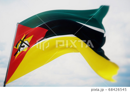 Waving flags of the world - flag of Mozambique. Shot with a shallow depth of field, selective focus. 3D illustration. 68426545
