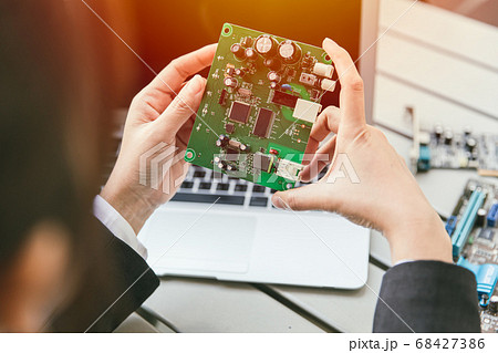 Engineer inspect final production of Printed circuit computer logic board 68427386