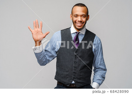 African-American businessmanman showing FIVE by finger over grey background 68428090