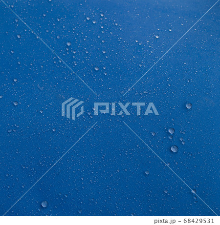 Water drops on a blue background 68429531