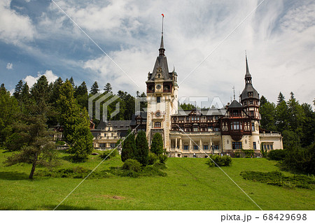 Panoramic view of Peles Castle, Romania. Famous Neo-Renaissance castle and ornamental garden in Sinaia, Carpathian Mountains in Europe. Panoramic view of Peles Castle, Romania. Famous Neo-Renaissance castle and ornamental garden in Sinaia, Carpathian Mountains in Europe. 68429698