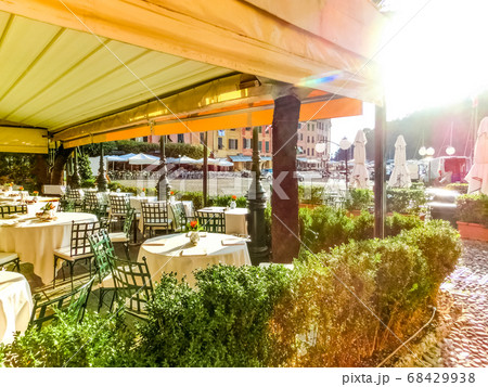 Beautiful cafe with colorful houses in Portofino, 68429938