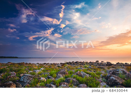 Rocky shores at the sea in sunset light Rocky shores at the sea in sunset light 68430044