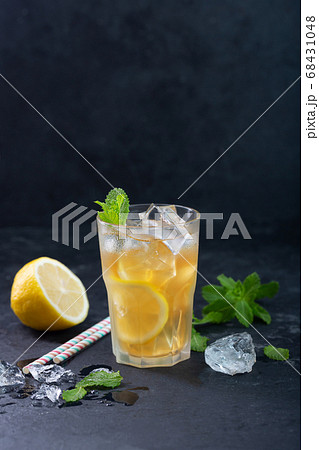 Lemon ice tea on dark background with mint and ice 68431048
