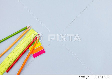 School supplies on a light blue background. 68431365