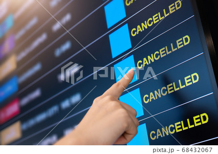 Flights cancelled on information time table board in airport  68432067