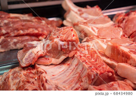 butcher. raw meat of pork to choose from. butcher. raw meat of pork to choose from. 68434980