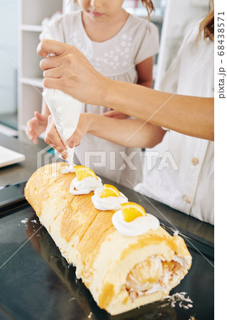 Decorating delicious cake 68438571