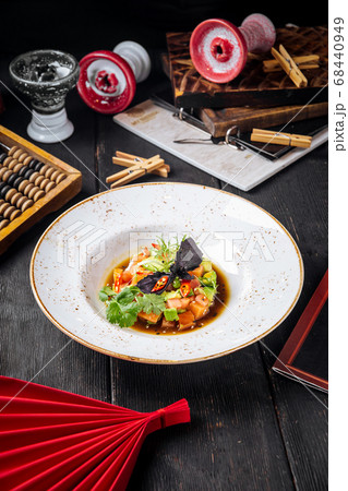 Tartare with red fish and greens in a sauce Tartare with red fish and greens in a sauce 68440949